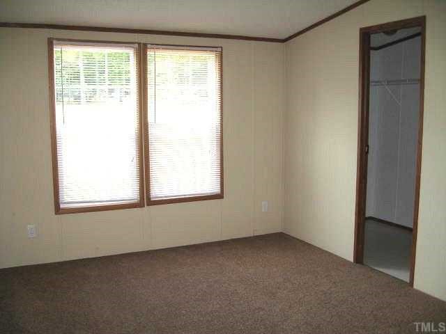 2585 Lucy Garrett Road Timberlake, NC 27583 - Photo 8 of 12 an empty room with a window