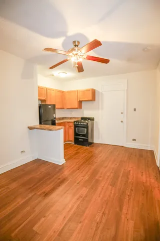 a view of a kitchen with microwave and cabinets