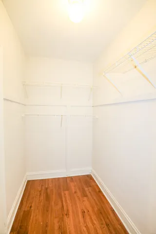 a view of a small space with wooden floor