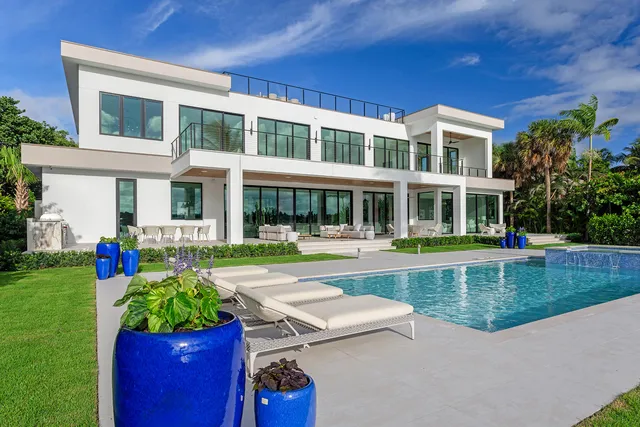 a front view of a building with a yard