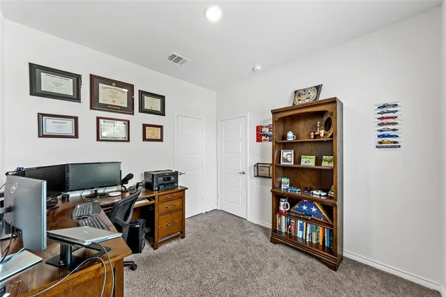 a view of a workspace with furniture