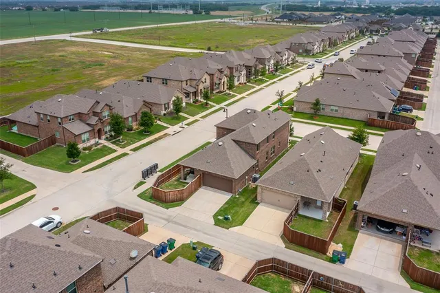 an aerial view of a house with a ocean view