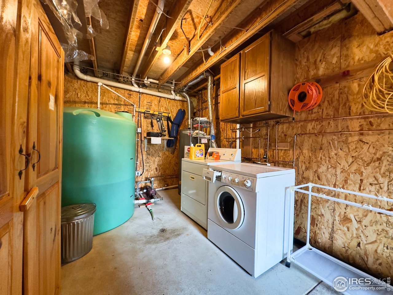 3676 Cherokee Meadows Road Livermore, CO 80536 - Photo 25 of 43 a utility room with dryer and washer