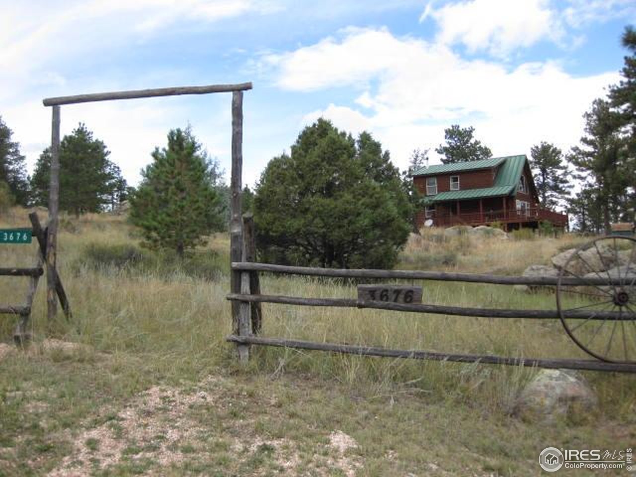 3676 Cherokee Meadows Road Livermore, CO 80536 - Photo 38 of 43 a view of a lake view