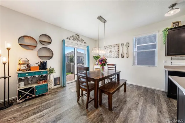 a living room with furniture floor to ceiling window and a flat screen tv