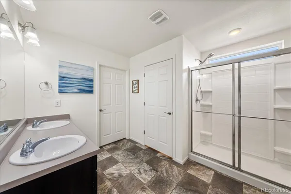 a view of a bathroom with a sink and mirror