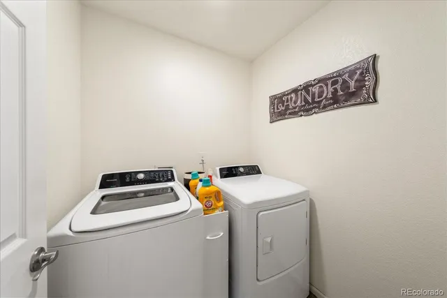 a bathroom with a double vanity sink toilet and shower