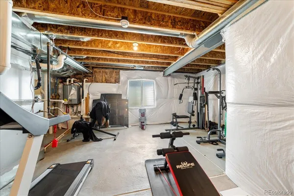 a view of a balcony with wooden floor and outdoor seating
