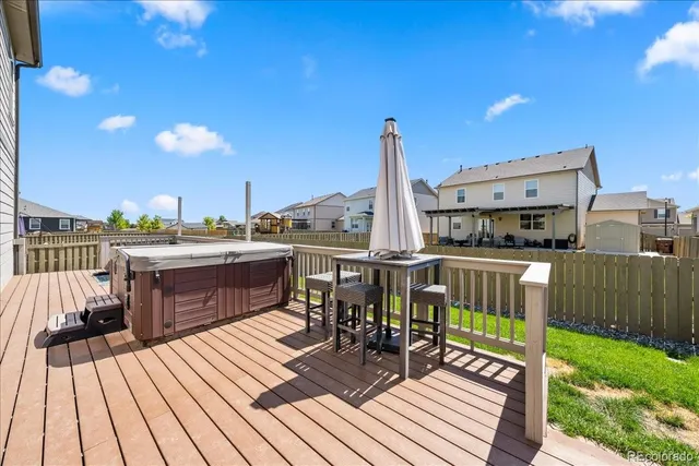 a view of a balcony with two chairs