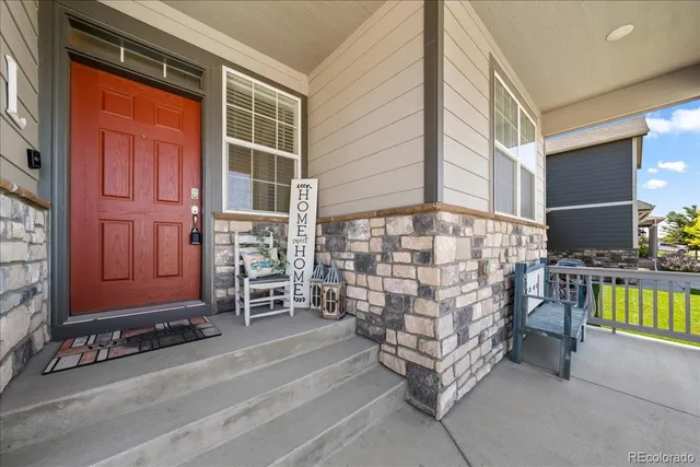a brick building with a bench and a window