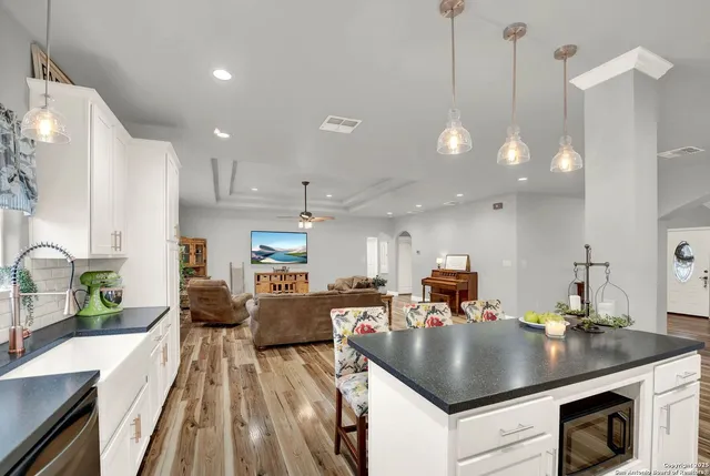 a kitchen with a sink and cabinets