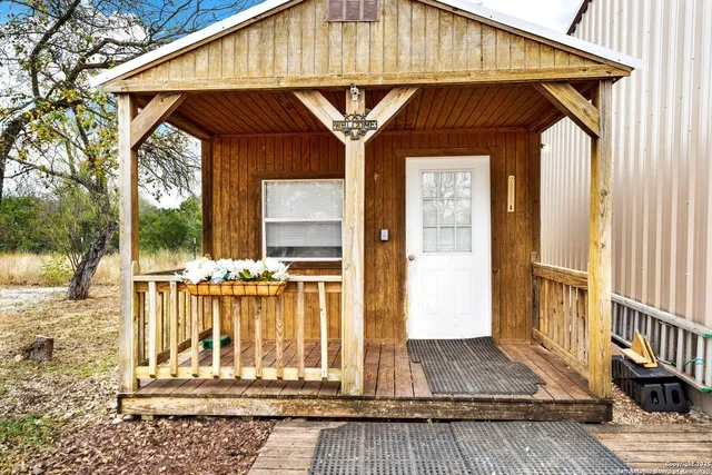 a room with gym equipment and a chandelier