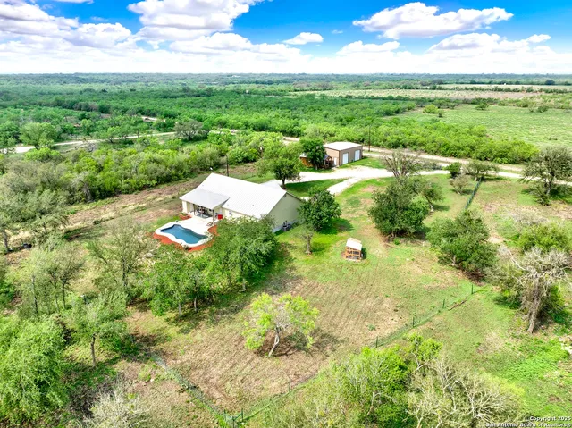 a view of a garden with a lake view