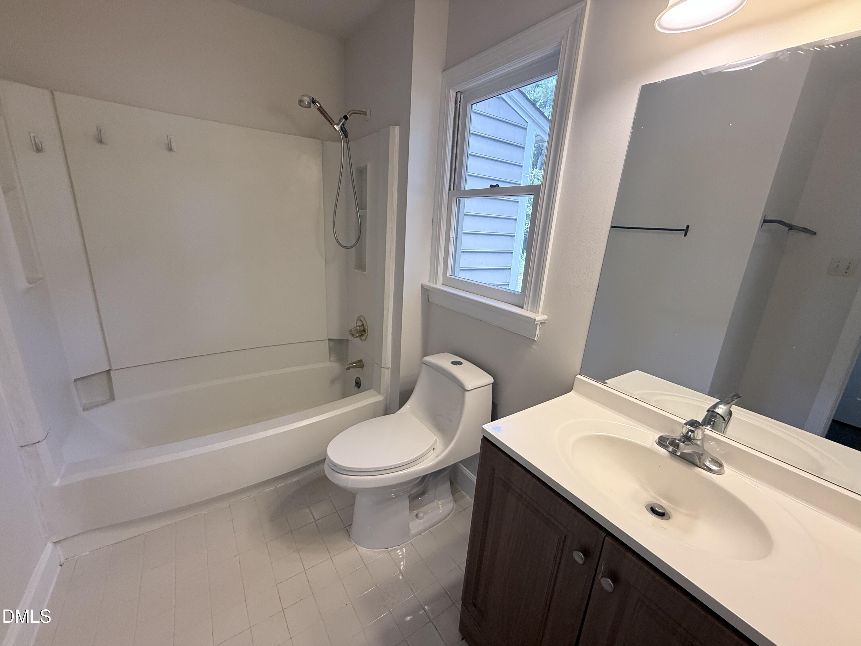 2900 Broadlands Drive Raleigh, NC 27604 - Photo 31 of 60 a bathroom with a sink a toilet and shower