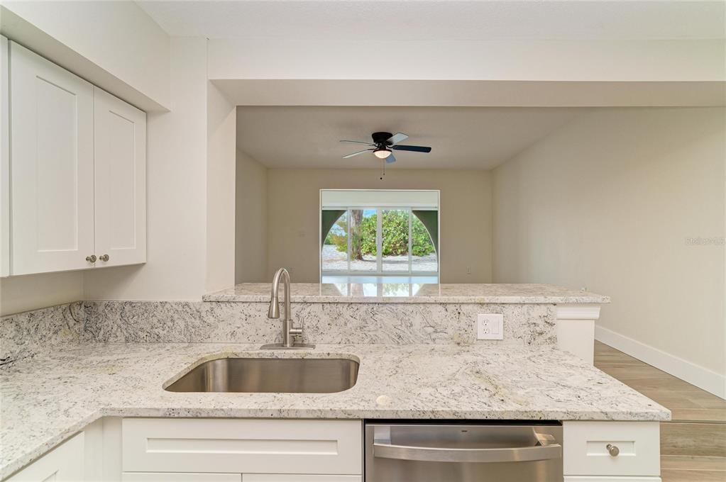 101 73rd Street, Unit 3 Holmes Beach, FL 34217 - Photo 20 of 53 a view with granite countertop a sink and a window