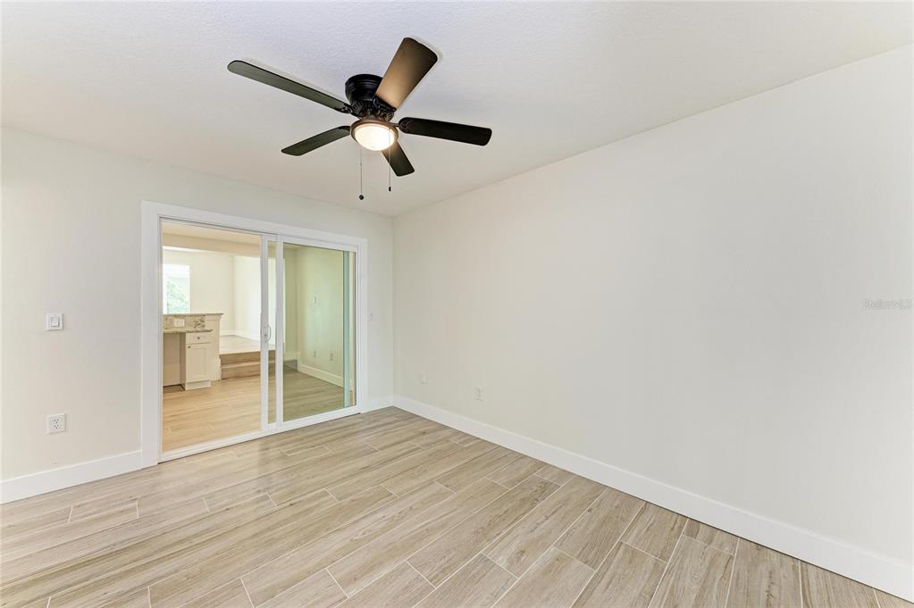 101 73rd Street, Unit 3 Holmes Beach, FL 34217 - Photo 26 of 53 a view of empty room with wooden floor