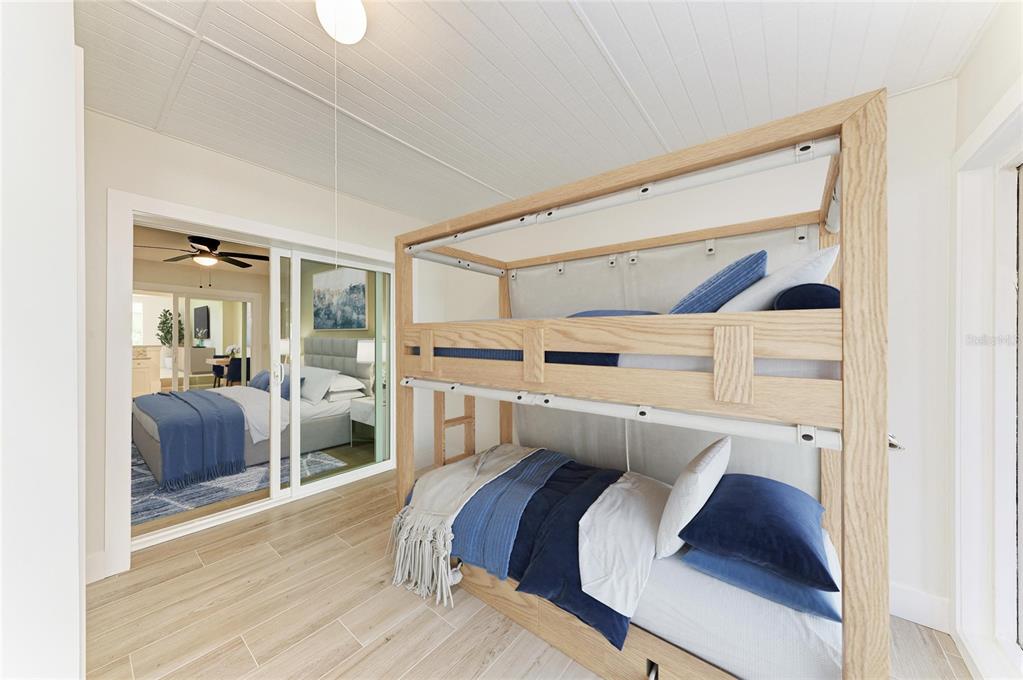 101 73rd Street, Unit 3 Holmes Beach, FL 34217 - Photo 29 of 53 a view of bedroom with furniture and wooden floor