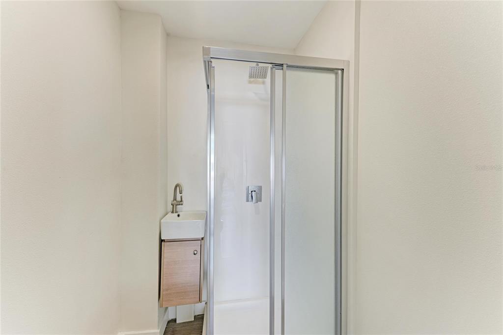 101 73rd Street, Unit 3 Holmes Beach, FL 34217 - Photo 32 of 53 a bathroom with a shower