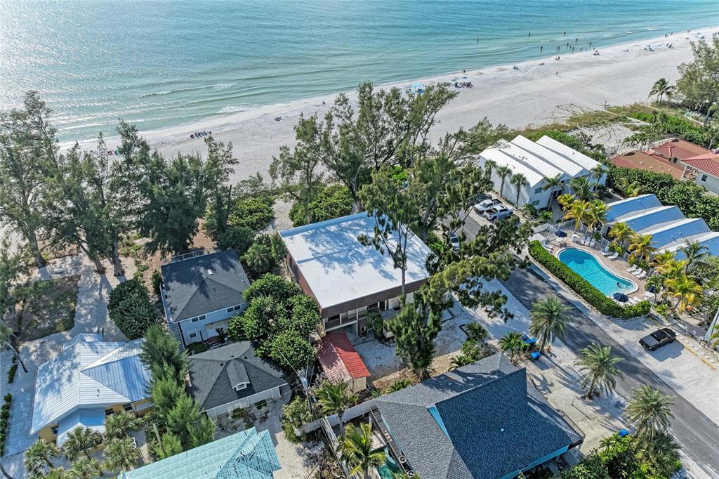 101 73rd Street, Unit 3 Holmes Beach, FL 34217 - Photo 49 of 53 an aerial view of a house with a yard