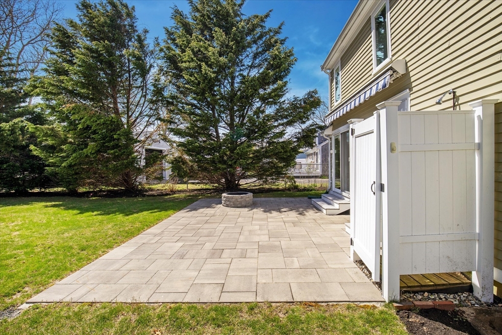 69 Jericho Path Falmouth, MA 02540 - Photo 11 of 42 a view of a back yard of the house