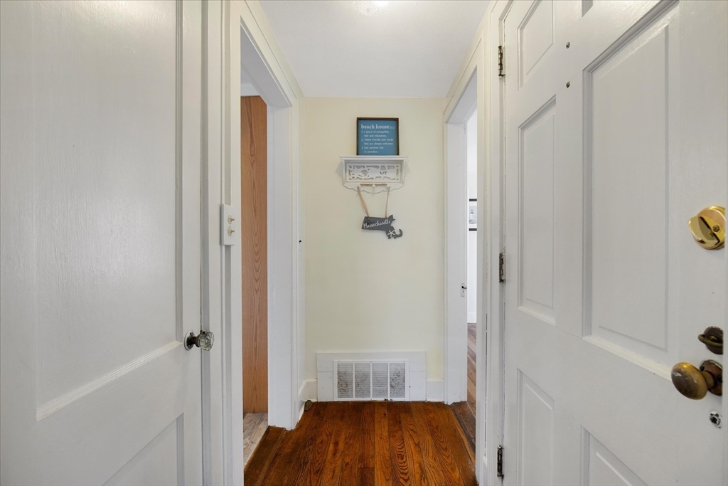 69 Jericho Path Falmouth, MA 02540 - Photo 13 of 42 a view of a hallway with wooden floor and closet