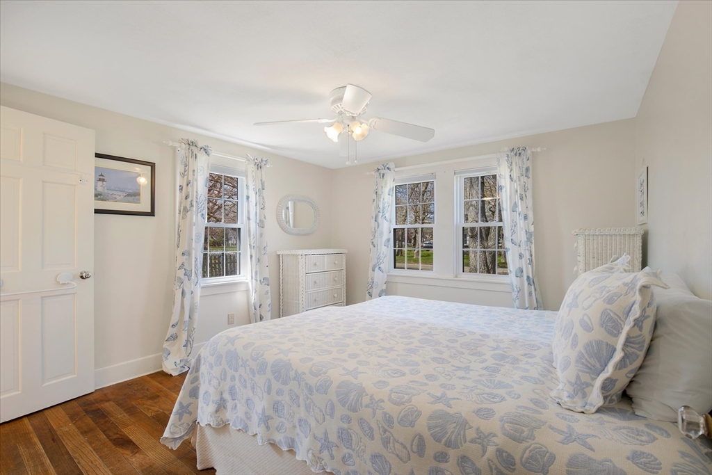 69 Jericho Path Falmouth, MA 02540 - Photo 17 of 42 a spacious bedroom with a large bed closet and window