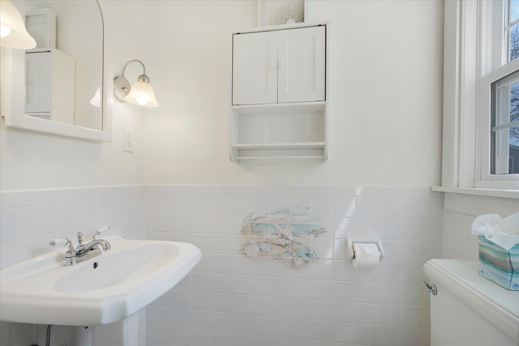 69 Jericho Path Falmouth, MA 02540 - Photo 19 of 42 a bathroom with a sink and a mirror