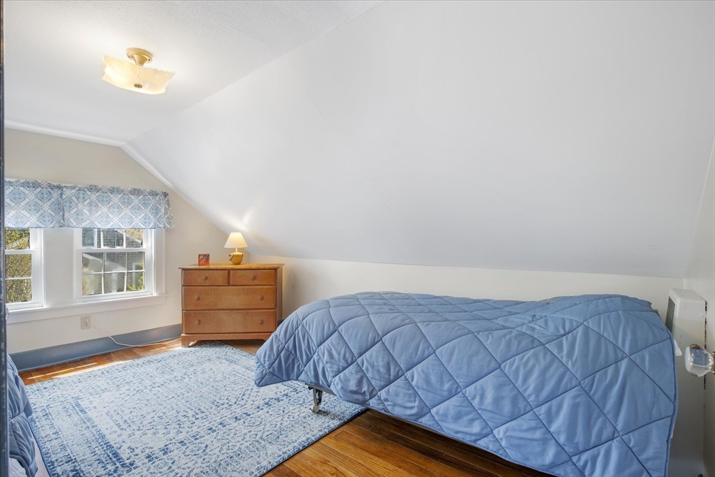 69 Jericho Path Falmouth, MA 02540 - Photo 30 of 42 a bedroom with a bed and window