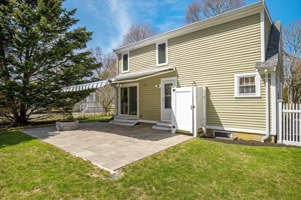 69 Jericho Path Falmouth, MA 02540 - Photo 33 of 42 a view of a house with backyard and sitting area