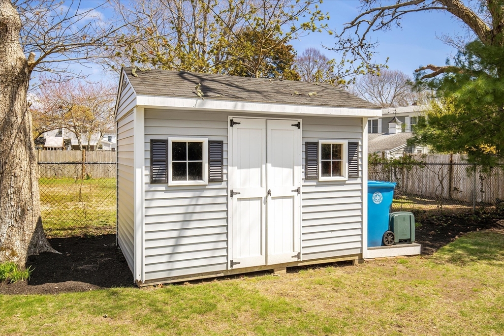 69 Jericho Path Falmouth, MA 02540 - Photo 8 of 42 a view of a white house with a large windows