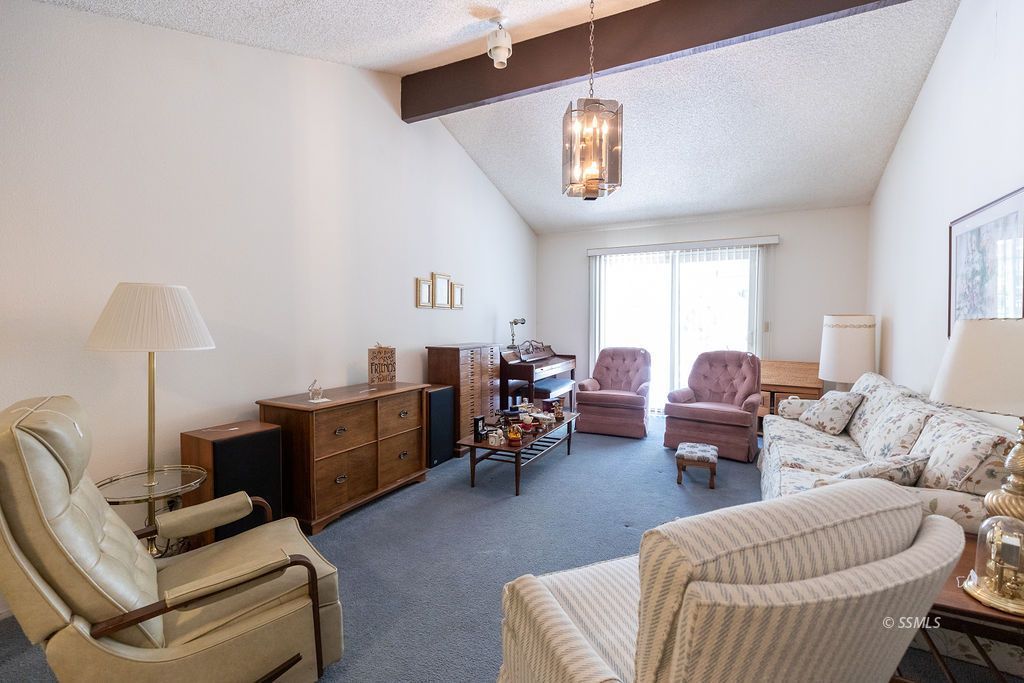 831 Peg Street Ridgecrest, CA 93555 - Photo 5 of 32 a living room with furniture and a window