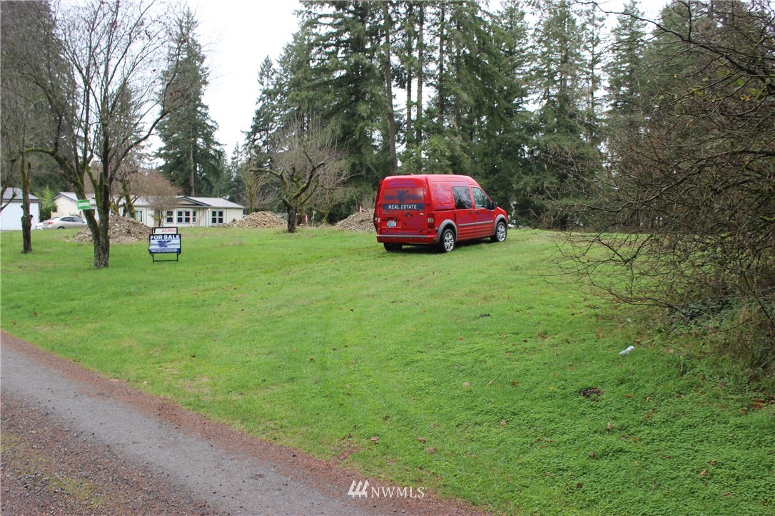 17133 Sargent Road Southwest Rochester, WA 98579 - Photo 13 of 14 a view of a yard with a house and large trees