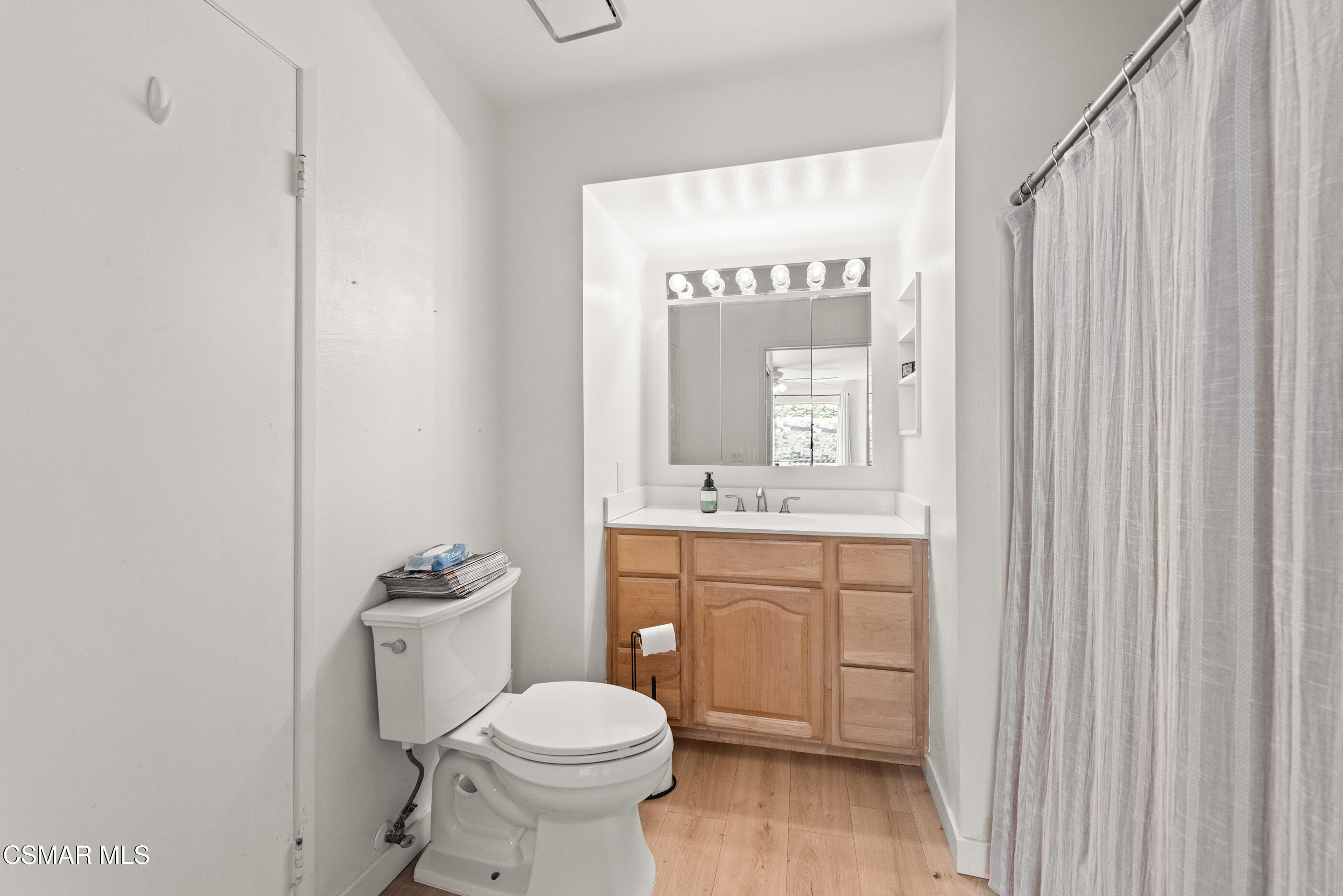 1730 Sinaloa Road, Unit 310 Simi Valley, CA 93065 - Photo 19 of 36 a bathroom with a toilet a sink and a window