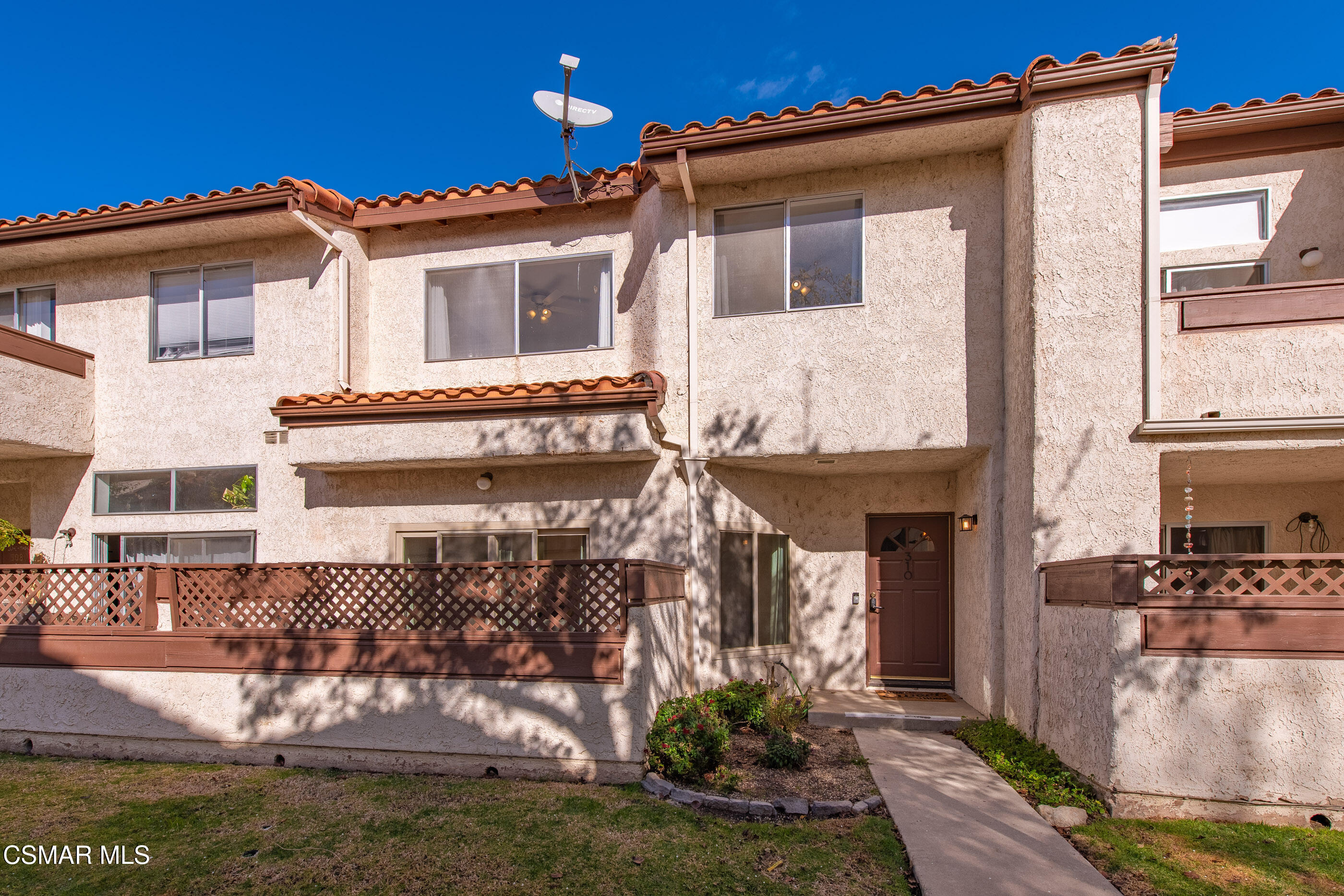 1730 Sinaloa Road, Unit 310 Simi Valley, CA 93065 - Photo 22 of 36 a front view of a house with a yard