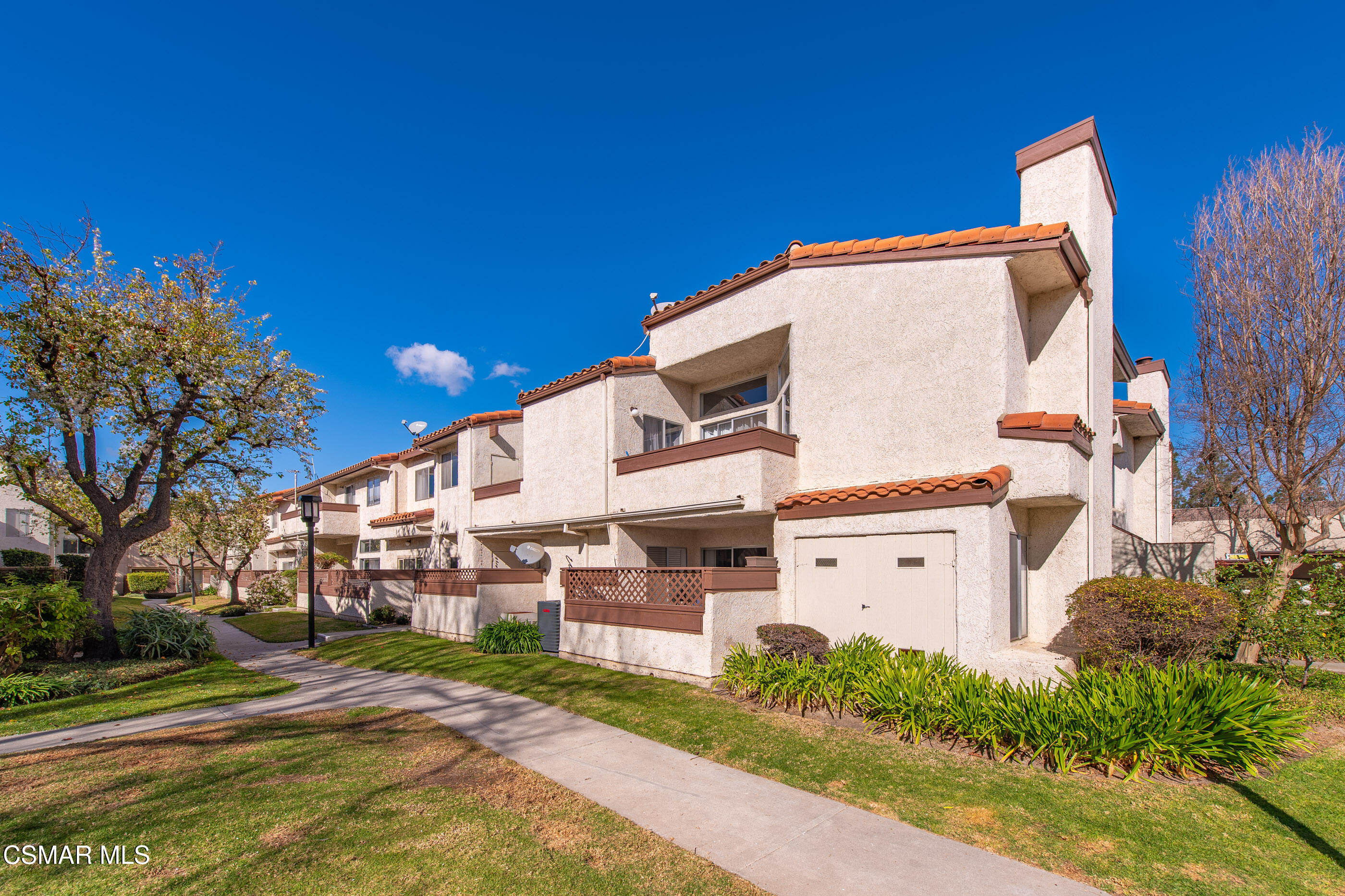 1730 Sinaloa Road, Unit 310 Simi Valley, CA 93065 - Photo 23 of 36 a view of a building with a yard