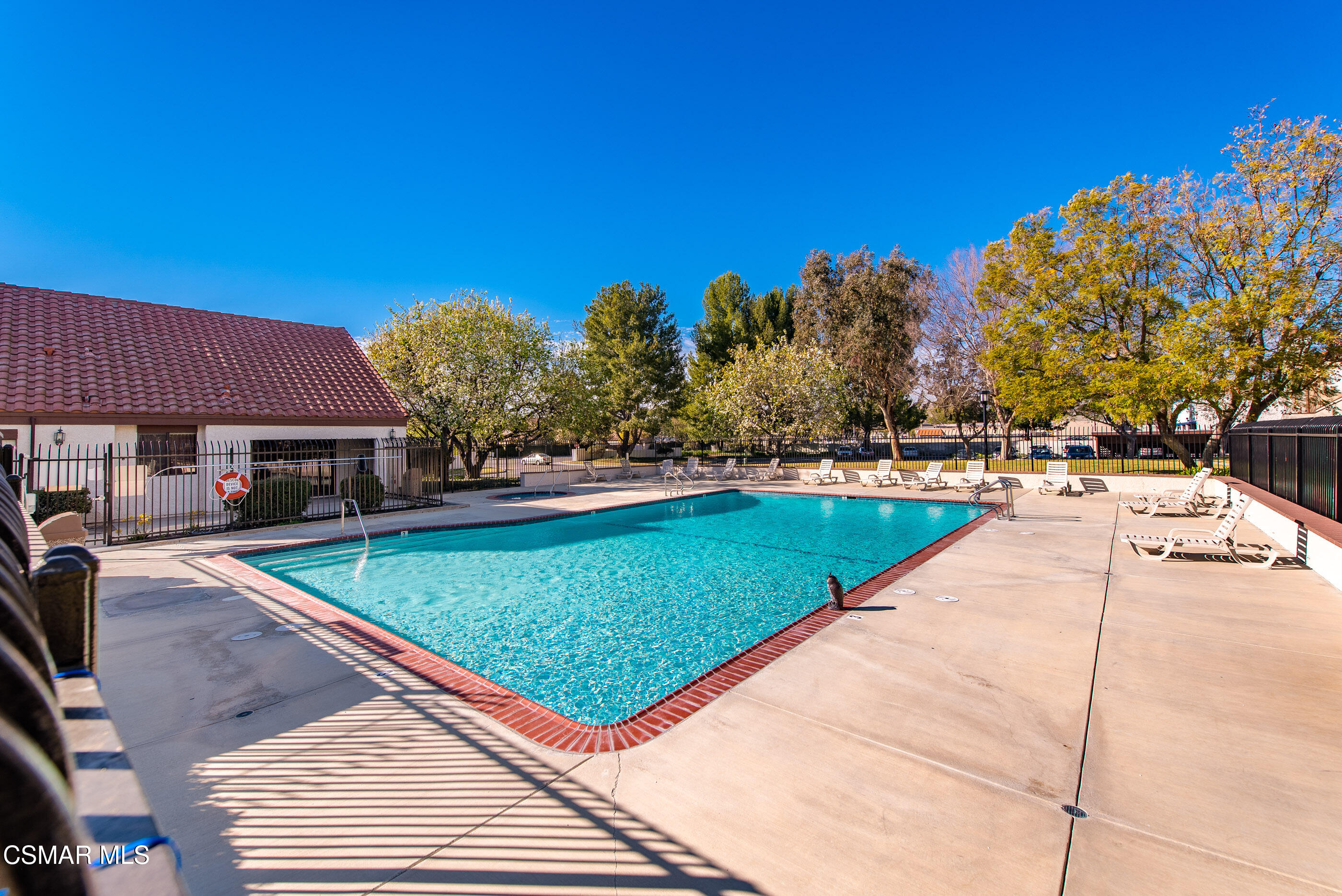 1730 Sinaloa Road, Unit 310 Simi Valley, CA 93065 - Photo 31 of 36 a view of a swimming pool with a lounge chairs