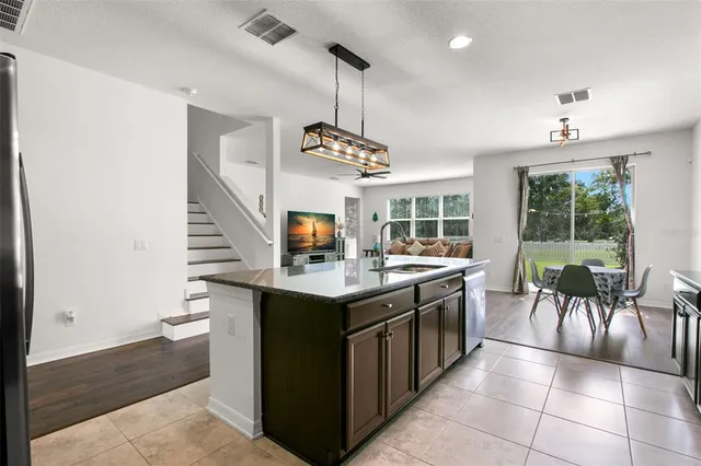 a kitchen with a stove and a sink