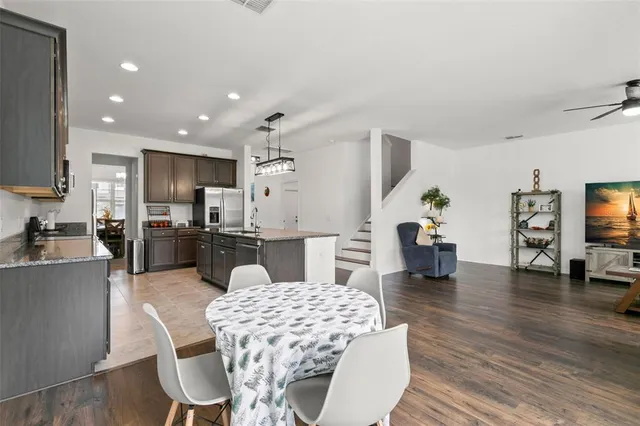 a dining room with furniture and window