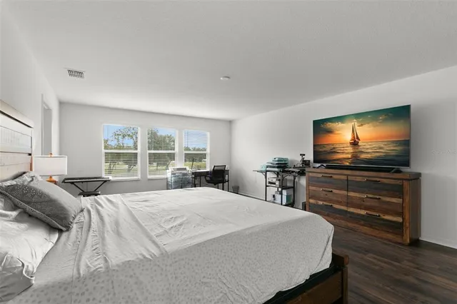 a view of walk in closet with clothes