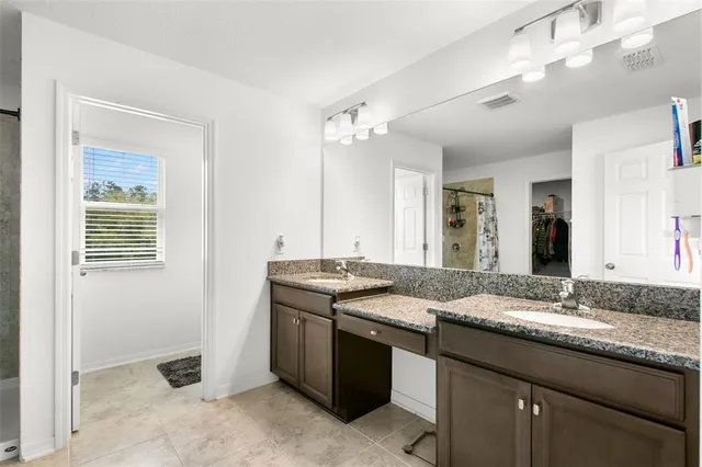 a room with a table chairs and entryway