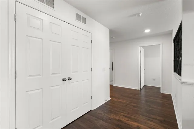 a bed room with a bed and a chair