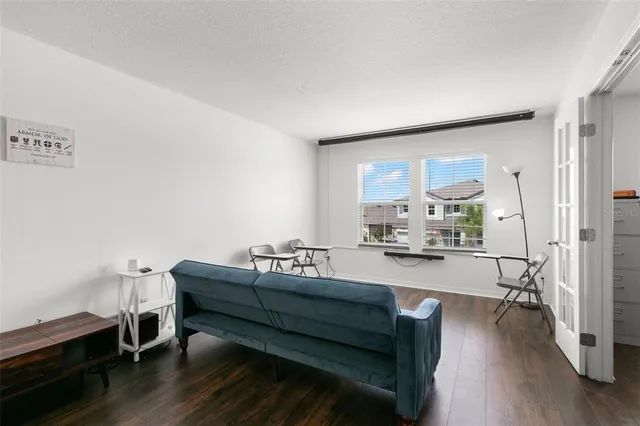 a bedroom with a bed and a table