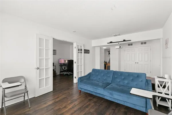 a view of walk in closet with clothes