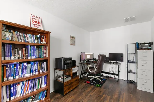 a room with a bed and a flat screen tv