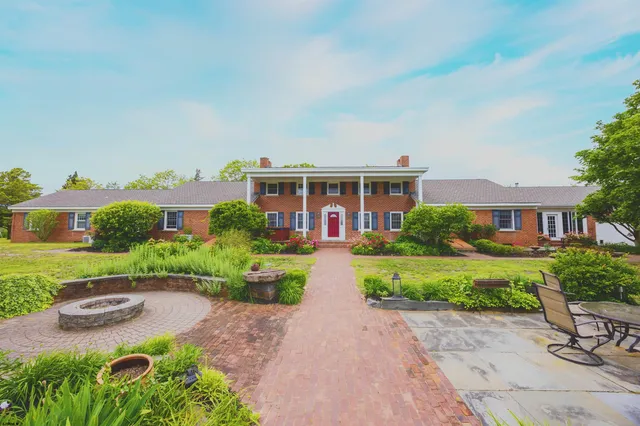 a view of swimming pool with a garden and seating area