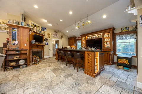 a bedroom with a bed and a view of kitchen