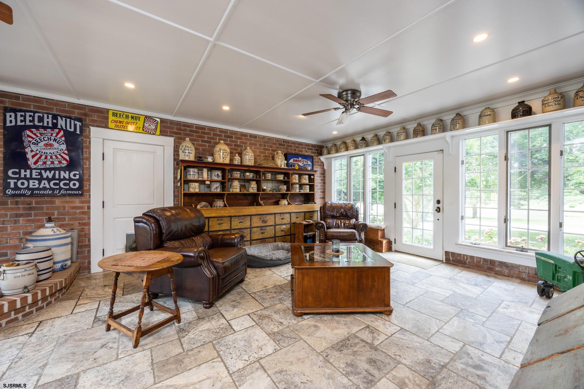3065 North Route 9 Ocean View, NJ 08230 - Photo 38 of 99 a living room with furniture a flat screen tv and a large window