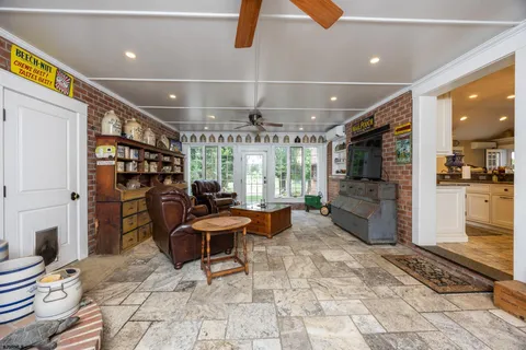 a living room with furniture and kitchen view