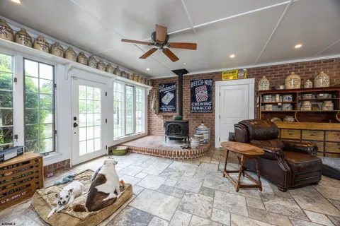 a large kitchen with stainless steel appliances granite countertop a sink and a refrigerator