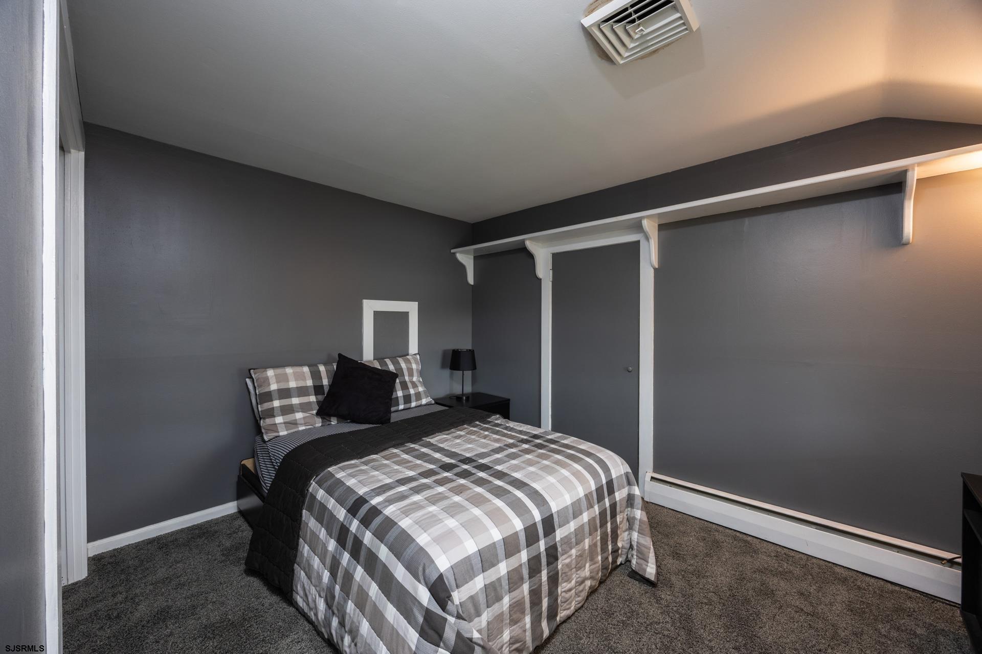 3065 North Route 9 Ocean View, NJ 08230 - Photo 48 of 99 a bedroom with a bed and a wall painting